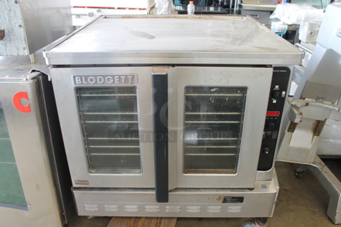 Blodgett Stainless Steel Commercial Natural Gas Powered Full Size Convection Oven w/ View Through Doors and Metal Oven Racks.