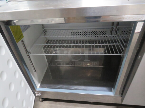 One WORKING Artic Air 2 Door Refrigerated Prep Table With 2 Racks, On Casters. Model# AST60RZ. 115 Volt. 61X30X44. - Image 2 of 3