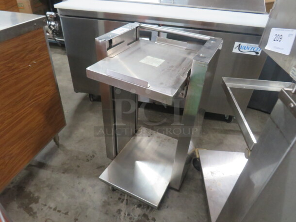 One Stainless Steel Spring Loaded Tray Transport On Casters. 20X21X35