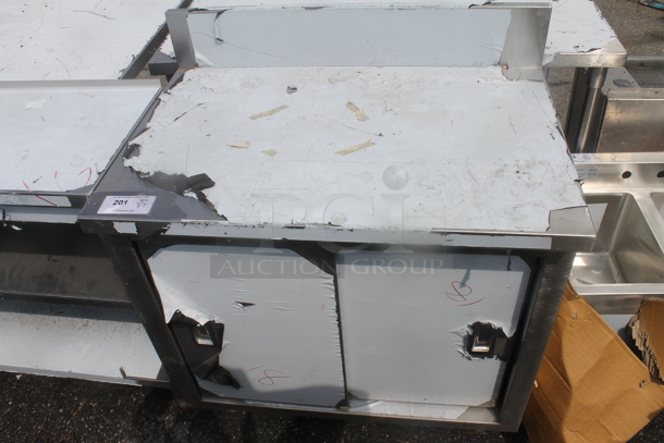 BRAND NEW SCRATCH AND DENT! Stainless Steel Commercial Counter w/ Back Splash, 2 Doors and Under Shelf. - Image 1 of 4