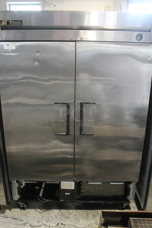 2014 True T-49F ENERGY STAR Stainless Steel Commercial Two Door Reach In Freezer w/ Poly Coated Racks on Commercial Casters. 115 Volts, 1 Phase. Tested and Working! - Image 1 of 8