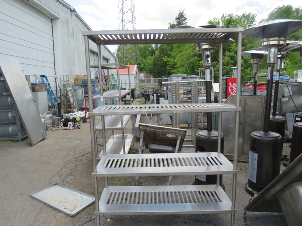 One Stainless Steel Shelving System With 4 Shelves. 60X20X77