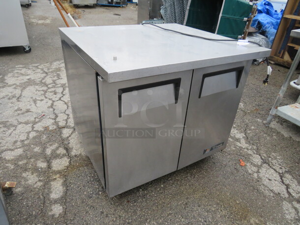 One WORKING True 2 Door Work Top Refrigerator With 2 Racks On Casters. 115 Volt. Model# TUC-36-34. 36X34X34 - Image 2 of 3