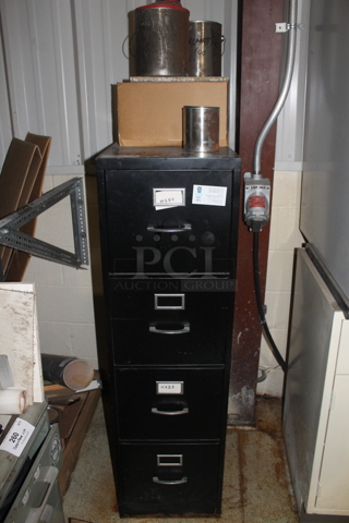 Black Metal 4 Drawer Filing Cabinet w/ Contents. BUYER MUST REMOVE.