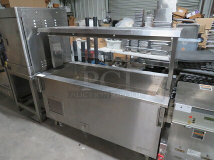 One Stainless Steel Vollrath Refrigerated Cold Well With Stainless Steel Top, And Sneeze Guard On Casters. Model# 36165-00001-EFA. 120 Volt. 60X28X51