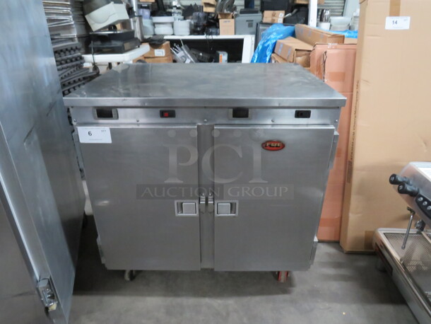 One 2 Door FWE SS Worktop Heat And Hold On Casters. WORKING!  Model# HLC-16-CHP. 120 Volt. 34X25X33 - Image 1 of 4