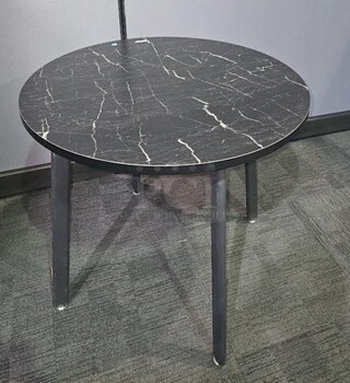 Item #70- Smaller black wooden table with marbled style wooden top. In fair used condition with signs of needing the legs to be repainted, but a nice piece with great potential for any space. Measures 29” H x 31.5” D. 

