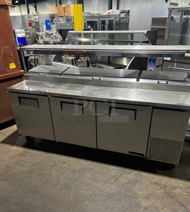 True Commercial Refrigerated 3 Door Pizza Prep Table! With Overhead Shelf! With Ticket Rail! All Stainless Steel! On Casters! Model: TPP93 SN: 4979455 115V 60HZ 1 Phase - Image 1 of 11