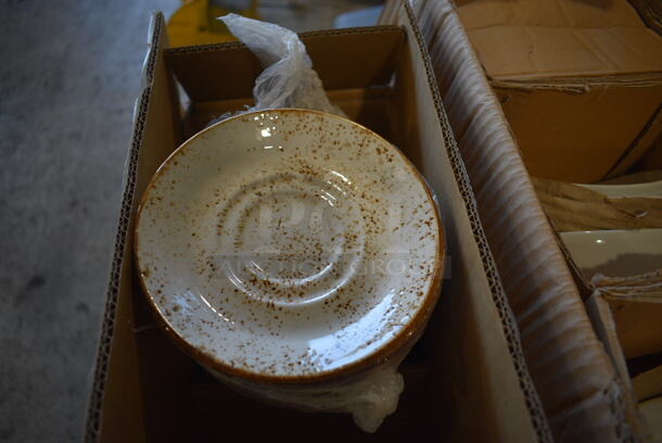 36 BRAND NEW IN BOX! White Ceramic Saucers w/ Brown Specks. 5.75x5.75x1. 36 Times Your Bid!