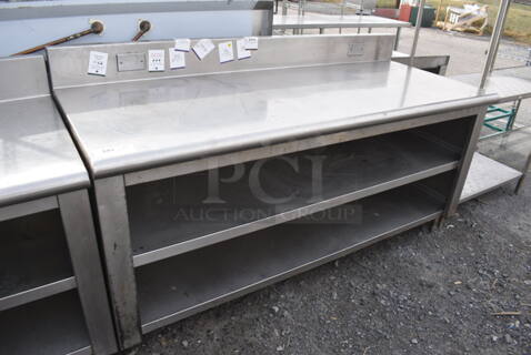 Stainless Steel Table w/ Back Splash and 2 Under Shelves. 72x30x40