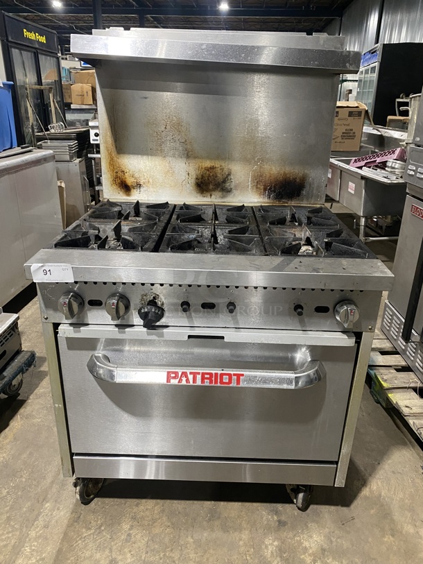 Patriot FMGR-36/NG Stainless Steel Commercial Natural Gas Powered 6 Burner Range w/ Oven and Back Splash on Commercial Casters!19105340067! - Image 1 of 10