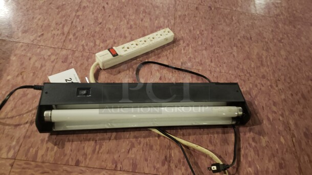 1 Black Light and 1 Power Strip (Location 1) - Image 1 of 1