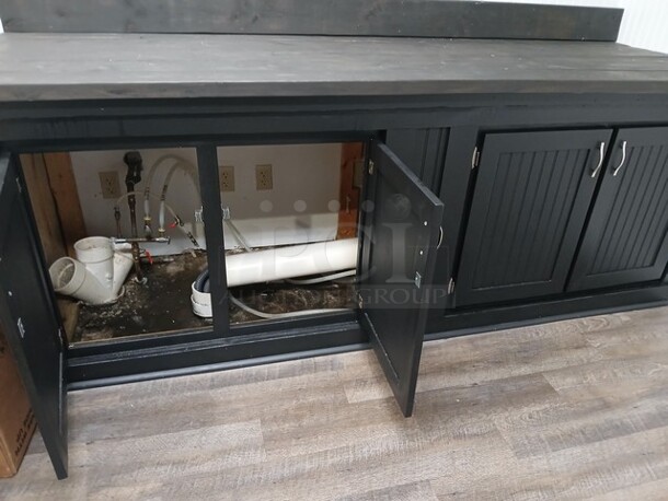 Black Built in Place Cabinet W/4 Doors. 
96"x33"x36"

**LABOR FOR REMOVAL ADDITIONAL FEE, CONTACT MISSOURI DIVISION FOR LABOR QUOTE OR ADDITIONAL QUESTIONS. - Image 3 of 5