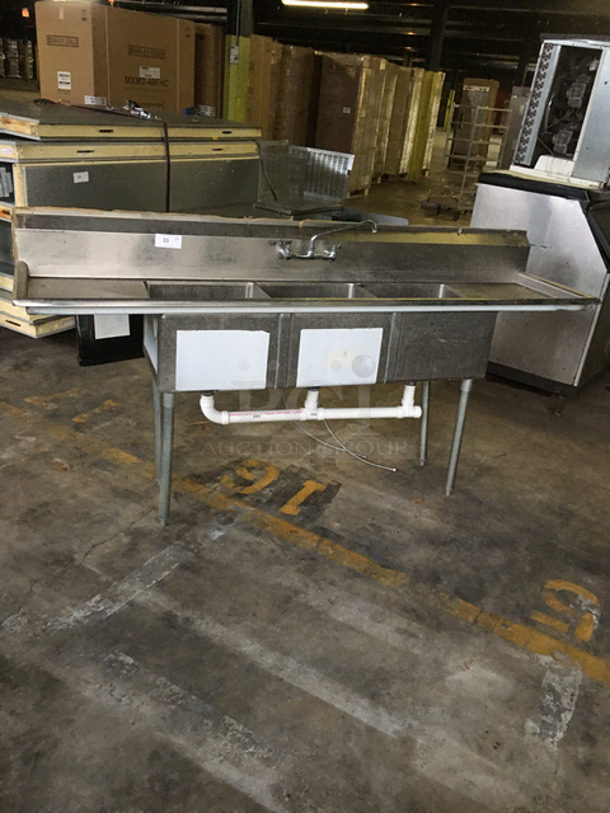 SWEET! Stainless Steel Commercial 3 Bay Sink! With Dual Drain Boards! With Faucet And Handles! On Legs! Model: BPS1834318FE SN: 2003240224