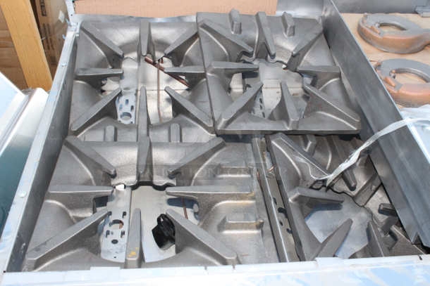 BRAND NEW SCRATCH & DENT! Garland G60-4G36RR Natural Gas 4 Burner 60" Range with 36" Griddle and 2 Standard Ovens - 262,000 BTU. S/N: 2310100102544 Rail holding burners is bent, Splash Guard is bent, 1 knob not connected. (see photos)	 - Image 3 of 9