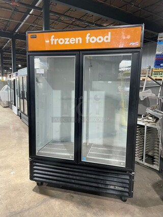 True Commercial Double Glass Door Reach In Freezer Merchandiser! With Poly Coated Racks! On Casters! 115/208V 1 Phase! Model: GDM-49F SN: 7405664!