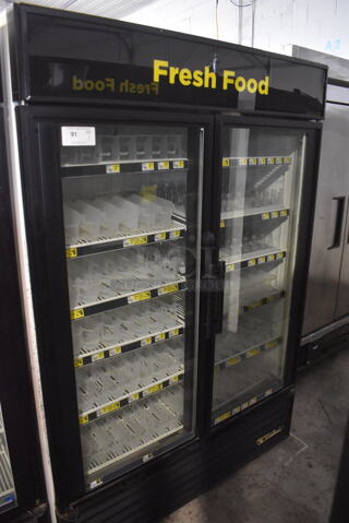 True GDM-49 Two Section Reach-In Floor Standing Glass Door Merchandiser Cooler In Black With Plastic Dividers. 115V, 1 Phase. Tested And Working