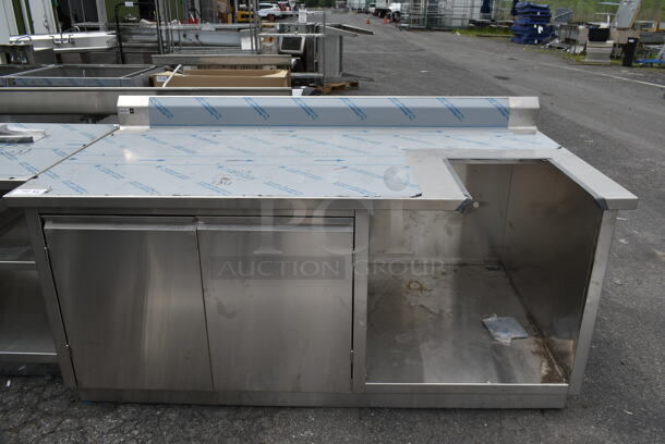 BRAND NEW SCRATCH AND DENT! Stainless Steel Commercial Counter w/ 2 Doors and Back Splash. - Image 1 of 7