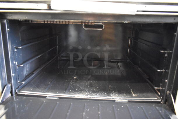 Garland G36-6R Stainless Steel Commercial Natural Gas Powered 6 Burner Range w/ Oven and Back Splash. - Image 7 of 8