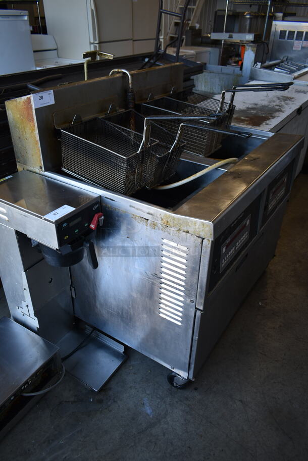 2015 Henny Penny OFG-342 Stainless Steel Commercial Floor Style Natural Gas Powered 2 Bay Deep Fat Fryer w/ Filtration System on Commercial Casters. 240,000 BTU.  - Image 2 of 11