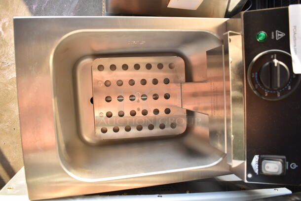 BRAND NEW SCRATCH AND DENT! Vollrath FFA8115 Stainless Steel Commercial Countertop Electric Powered Deep Fat Fryer w/ 2 Metal Fry Baskets. 115 Volts, 1 Phase.  - Image 5 of 6