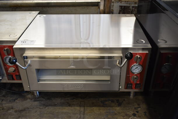BRAND NEW SCRATCH AND DENT! Avantco 177DPO18S Stainless Steel Commercial Countertop Electric Powered Single Deck Pizza Oven w/ Cooking Stone. 120 Volts, 1 Phase. Tested and Working! - Image 1 of 4