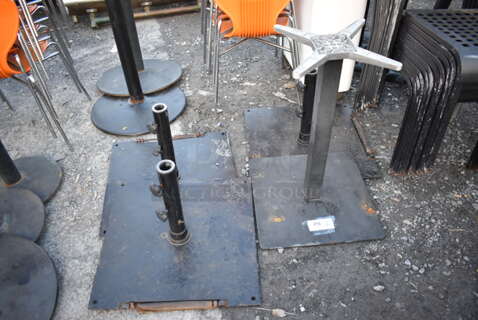 4 Metal Bases; 3 Patio Umbrella Bases and 1 Table Base. 24x24x16, 20x20x28. 4 Times Your Bid!