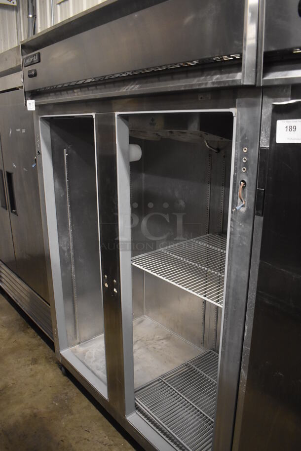 Continental 2FE Stainless Steel Commercial 2 Door Reach In Freezer on Commercial Casters. Missing Doors. 115 Volts, 1 Phase. 57x34x82. Tested and Does Not Power On