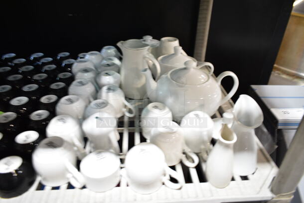 ALL ONE MONEY! Tier Lot of Various Items Including Ceramic Mugs, Pitchers and Blue Cutting Boards. - Image 4 of 9