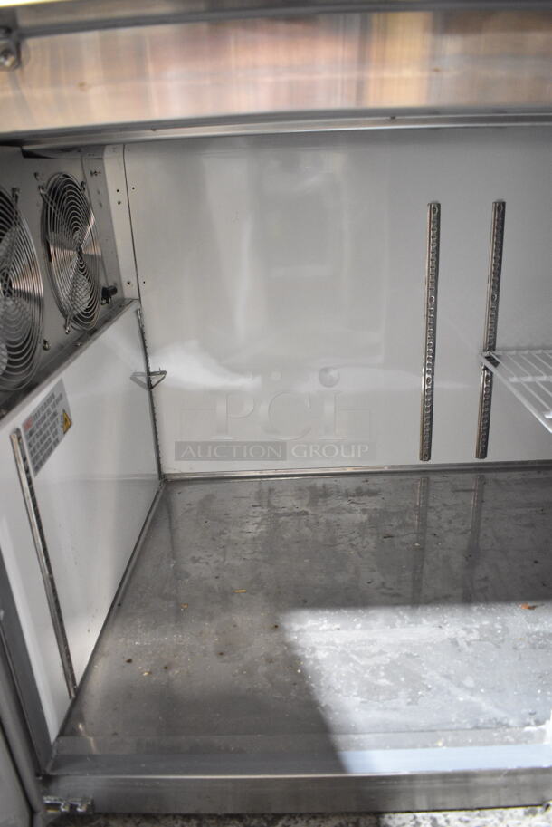 BRAND NEW SCRATCH AND DENT! 2023 Avantco 178APPT91HC Stainless Steel Commercial Pizza Prep Table. Comes w/ Commercial Casters. 115 Volts, 1 Phase. Tested and Does Not Power On - Image 8 of 9