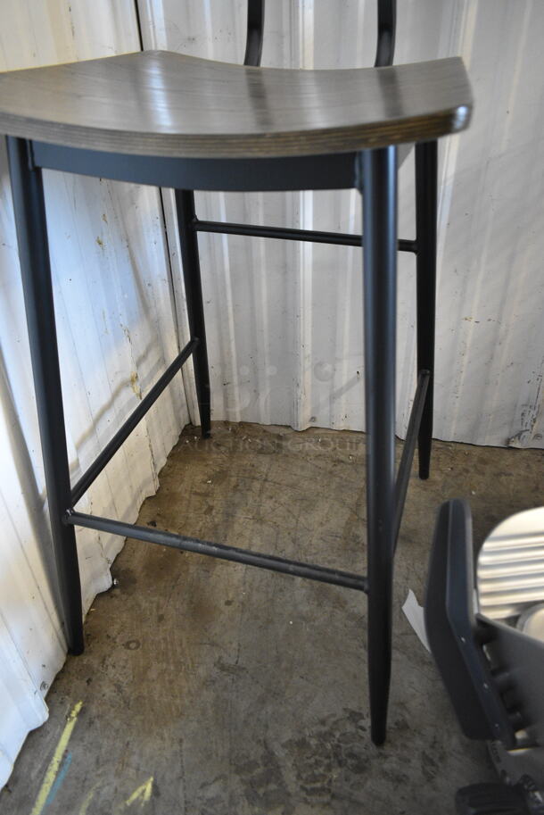 BRAND NEW SCRATCH AND DENT! Black Metal Bar Height Chair w/ Wooden Back Rest and Seat.  - Image 4 of 4