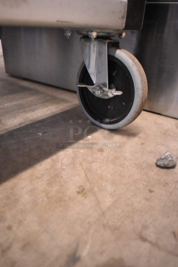 BRAND NEW SCRATCH AND DENT! Rubbermaid Black and Chrome Finish Pan Transport Rack on Commercial Casters.  - Image 4 of 4