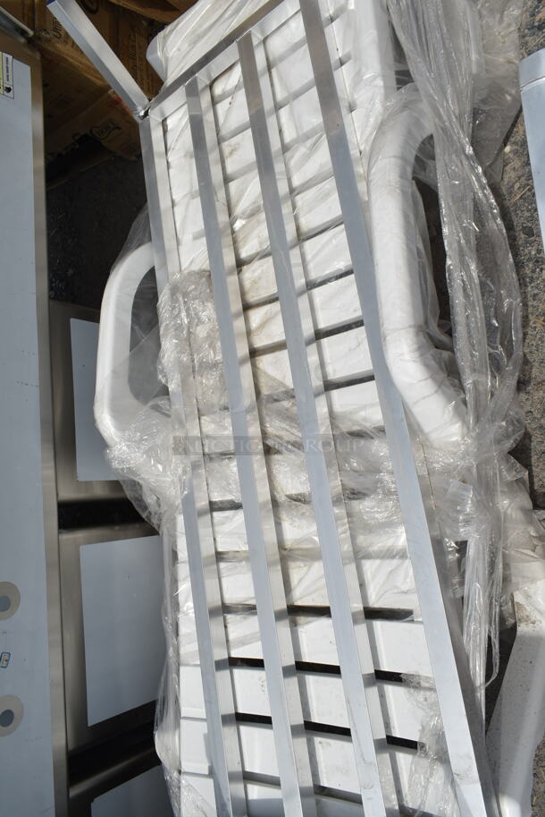 4 BRAND NEW SCRATCH AND DENT! Items; 1 White Resin Chaise Lounger and 3 Aluminum Dunnage Racks Including Regency 600DUN2036, Regency 600DUN1448, Regency 600DUN122060. See Pictures For Damage. 4 Times Your Bid! - Image 8 of 12