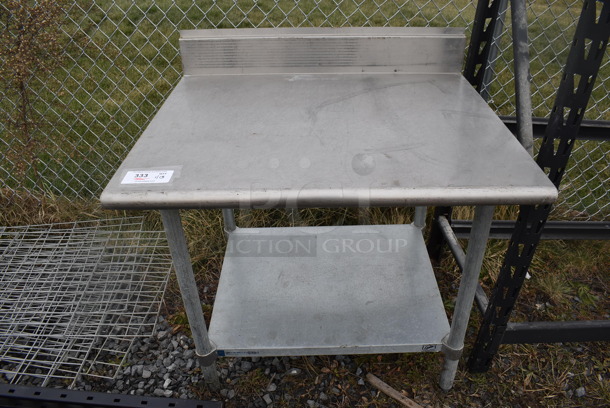 Stainless Steel Table w/ Back Splash and Under Shelf. 36x30x37