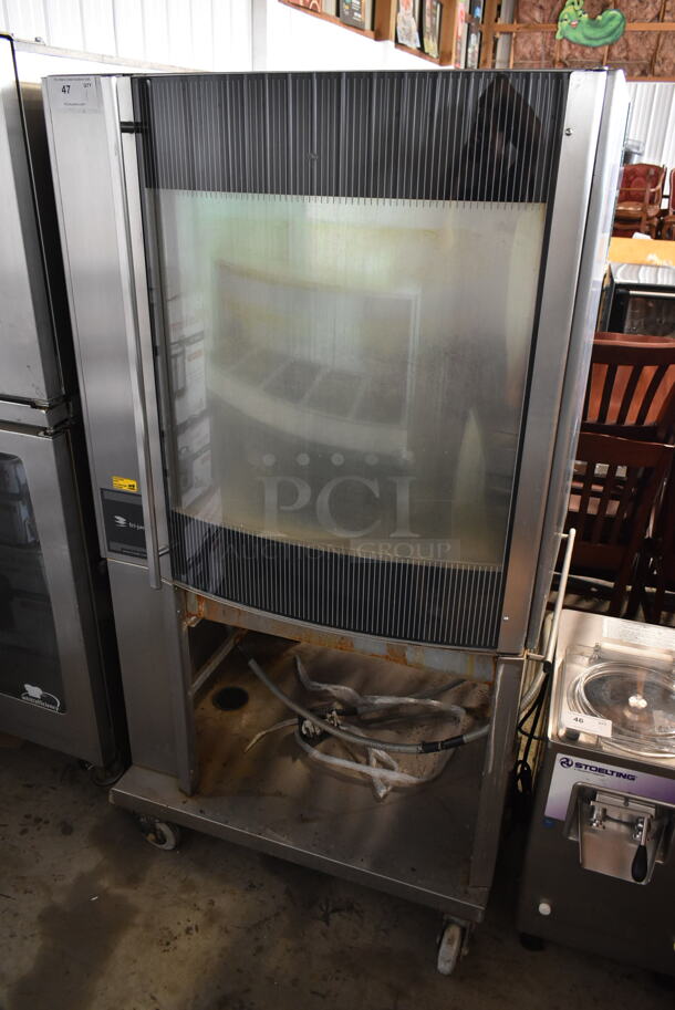 Fri-jado STG7-P Stainless Steel Commercial Electric Powered Rotisserie Oven w/ Under Shelf on Commercial Casters. 208 Volts, 3 Phase.
 - Image 1 of 9