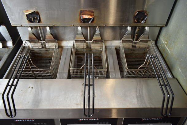 2020 Henny Penny OGA-323 ENERGY STAR Stainless Steel Commercial Natural Gas Powered 3 Bay Fryer w/ 3 Metal Fry Baskets on Commercial Casters. 255,000 BTU.  - Image 3 of 12