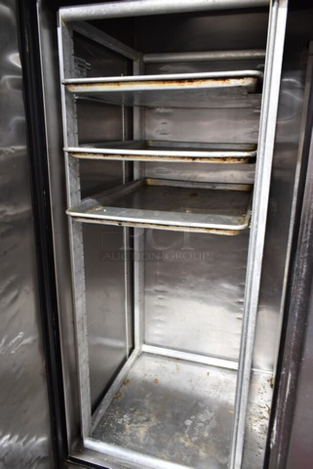 True TS-49 ENERGY STAR Stainless Steel Commercial 2 Door Reach In Cooler w/ Metal Rack, 3 Baking Pans and 2 Poly Coated Racks on Commercial Casters. 115 Volts, 1 Phase. Tested and Working! - Image 4 of 5