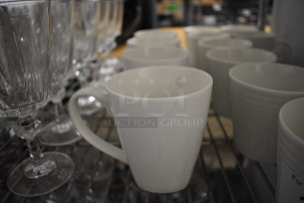 4 White Ceramic Mugs. 5.5x3.5x4. 4 Times Your Bid!