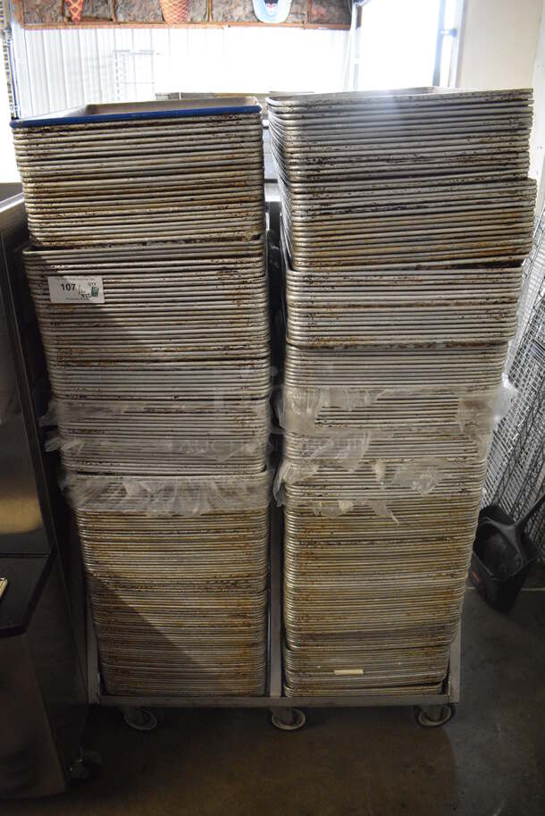 Metal Commercial Pan Transport Rack on Commercial Casters w/ 322 Metal Full Size Baking Pans. 41x27x55. 18x26x1 - Image 1 of 8