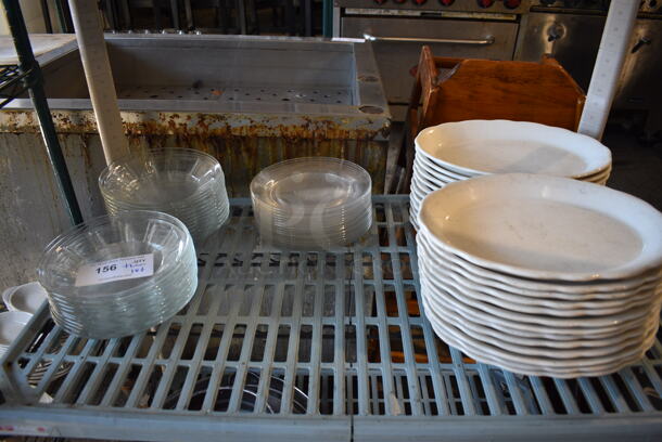 ALL ONE MONEY! Tier Lot of Approximately 38 Glass Plates and 25 White Ceramic Oval Plates. Includes 8x8x1.5