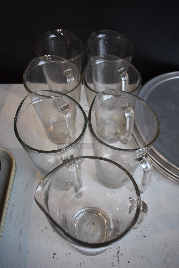 7 Glass Pitchers. 7x5.5x9. 7 Times Your Bid! - Image 2 of 3