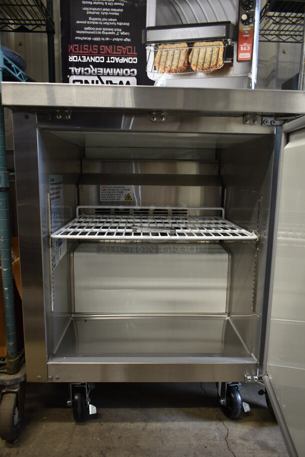 BRAND NEW SCRATCH AND DENT! 2023 Avantco 178AU27FHC Stainless Steel Commercial Single Door Undercounter Freezer on Commercial Casters. 115 Volts, 1 Phase. Tested and Working! - Image 3 of 4