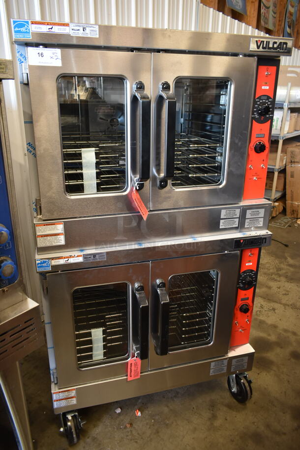 2 BRAND NEW SCRATCH AND DENT! Vulcan VC5ED ENERGY STAR Stainless Steel Commercial Electric Powered Full Size Convection Oven w/ View Through Doors, Metal Oven Racks and Thermostatic Controls on Commercial Casters. 240 Volts, 3/1 Phase. 2 Times Your Bid! Tested and Working!