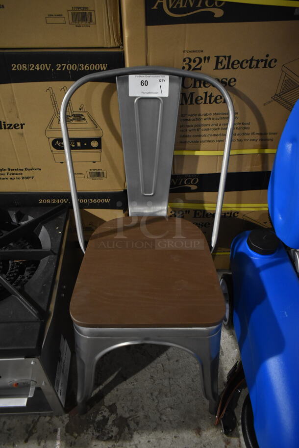 BRAND NEW SCRATCH AND DENT! Gray Metal Tolix Style Dining Height Chair w/ Wood Pattern Brown Seat. - Image 1 of 3