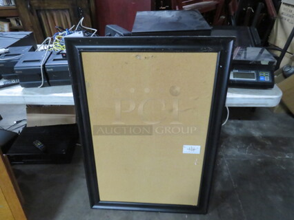 One Framed Cork Board. 28.5X41