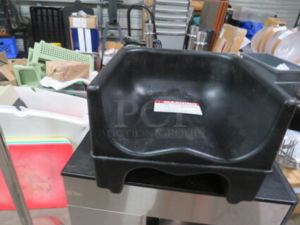 One Dual Sided Cambro Booster Seat. #200BC. 