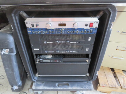One Portable Case On Casters With A Crown XLS402 Power Amplifier, Shure SLX4 Wireless Receiver, alesis Powertrip 8, And A SamsXon 3 Way Stereo Mono Crossover. X