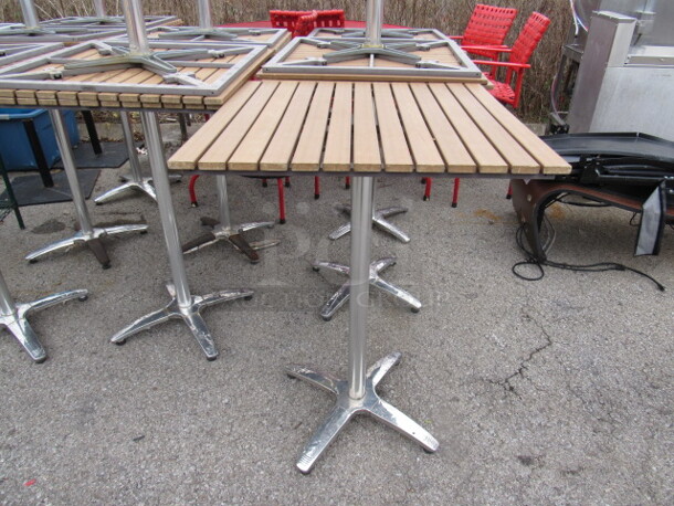 One Bar Height Patio Table On A Chromed Pedestal Base. 30X30X42.5