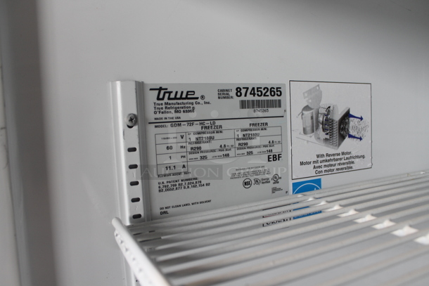 2016 True GDM-72F-HC-LD ENERGY STAR Metal Commercial 3 Door Reach In Freezer Merchandiser w/ Poly Coated Racks. 115/208-230 Volts, 1 Phase.  - Image 2 of 8