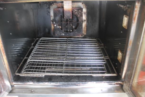 Vulcan VC4GD-11D150K Stainless Steel Commercial Natural Gas Powered Full Size Convection Oven w/ View Through Doors, Thermostatic Controls and Legs on Commercial Casters.  - Image 4 of 6